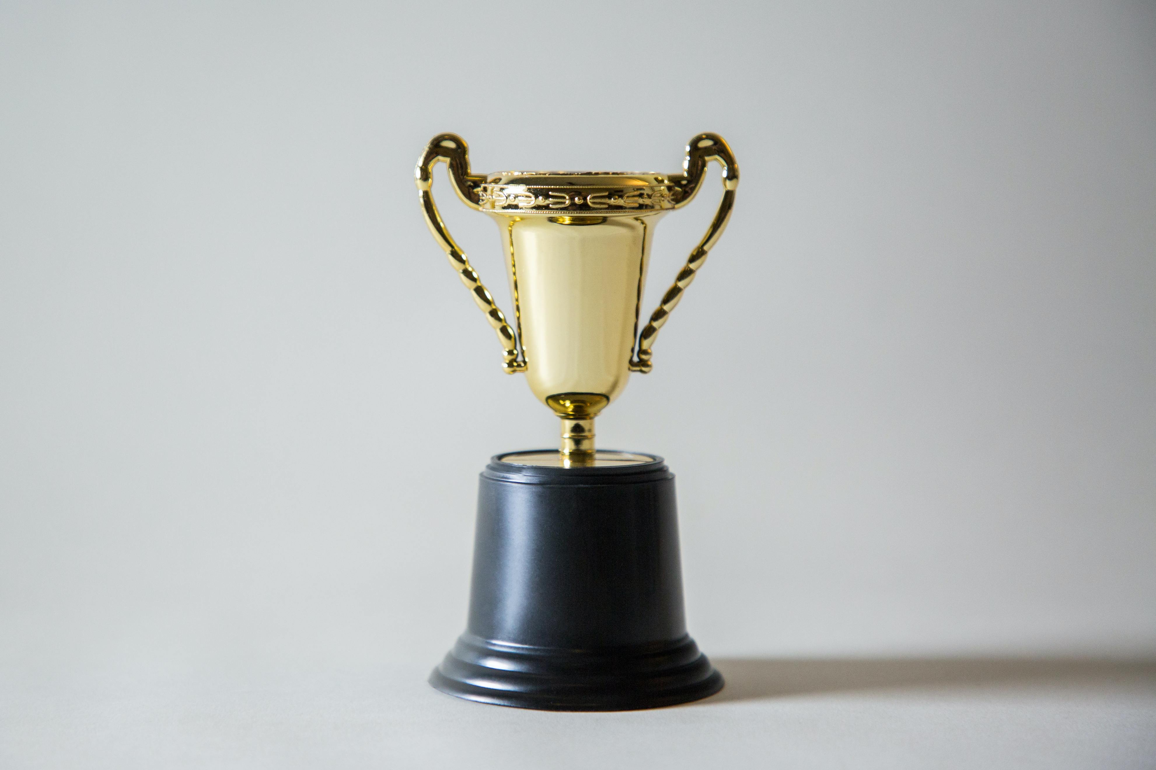 A trophy sitting on a table.